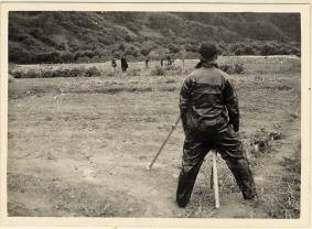 The prison land was a plane slope with the front higher than the back. It was sandy soil. The employed illustrator, Mr. Wu, must measure the land for the land grading.