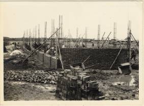 Laying bricks for the dormitory.